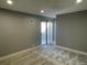 Carpeted bedroom featuring a sliding glass door, natural light, and neutral paint at 2441 S Xanadu Way # A, Aurora, CO 80014