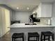 Stylish kitchen with a sleek breakfast bar, offering an inviting space to dine and entertain at 2441 S Xanadu Way # A, Aurora, CO 80014