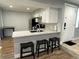 Charming kitchen featuring a breakfast bar with seating, modern appliances, and ample counter space at 2441 S Xanadu Way # A, Aurora, CO 80014