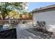 Spacious back deck featuring outdoor seating and space for entertainment at 13871 Ivy St, Thornton, CO 80602