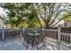 Enjoy outdoor dining on this back deck with fenced yard and mature trees at 13871 Ivy St, Thornton, CO 80602
