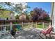 Comfortable seating and peaceful views from this fenced backyard at 13871 Ivy St, Thornton, CO 80602