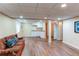Finished basement with kitchenette and sitting area, ideal for recreation at 13871 Ivy St, Thornton, CO 80602