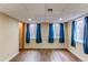 Finished basement offering natural light and windows with blue drapes at 13871 Ivy St, Thornton, CO 80602