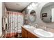 Clean bathroom with double sinks and a shower-tub combo with modern fixtures and neutral finishes at 13871 Ivy St, Thornton, CO 80602