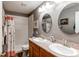 Bathroom featuring double sinks and a shower-tub combo offering practical convenience and comfort at 13871 Ivy St, Thornton, CO 80602