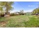 Large, grassy backyard with wood fence and table at 741 Quitman St, Denver, CO 80204