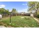 Large, grassy backyard with wood fence and table at 741 Quitman St, Denver, CO 80204