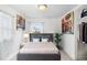Cozy bedroom with neutral tones, decorative art, and a comfortable bed at 741 Quitman St, Denver, CO 80204