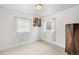Bedroom with white walls, light-colored carpet, and natural light at 741 Quitman St, Denver, CO 80204