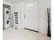 Entryway area with stacked washer and dryer and white door at 741 Quitman St, Denver, CO 80204