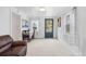 Bright living room featuring fresh paint, with a view through to the front door at 741 Quitman St, Denver, CO 80204