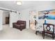 Bright living room featuring fresh paint, with a view into the kitchen and another room at 741 Quitman St, Denver, CO 80204