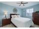 Cozy bedroom with stylish decor, featuring a ceiling fan and a bright window at 486 Balsa Dr, Castle Rock, CO 80104