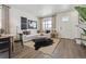 Bright and airy living room with large windows and neutral colors at 9854 Bahama St, Commerce City, CO 80022