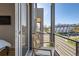 Private balcony with a chair offering views of the neighborhood and street at 3880 W 13Th Ave, Denver, CO 80204