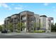 Modern multi-story condo building featuring balconies, contemporary design and manicured landscaping at 3880 W 13Th Ave, Denver, CO 80204