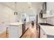 Spacious kitchen with a large island, stainless steel appliances, and an open floor plan at 3880 W 13Th Ave, Denver, CO 80204