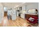 Bright open kitchen with a large island, modern appliances, and hardwood floors at 3880 W 13Th Ave, Denver, CO 80204