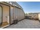 Stylish rooftop deck featuring patio furniture, storage, and string lights at 3880 W 13Th Ave, Denver, CO 80204