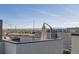 Rooftop deck with open seating area and scenic mountain views in the background at 3880 W 13Th Ave, Denver, CO 80204