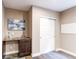Basement bar area with dark wood cabinets, granite countertop, and stylish backsplash at 3353 Wabash St, Denver, CO 80238
