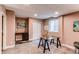Basement with a bar and wine cooler along with work space and a glass top desk at 3353 Wabash St, Denver, CO 80238