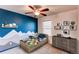 Charming bedroom featuring vibrant wall art, creative decor, and comfortable furniture at 3353 Wabash St, Denver, CO 80238