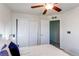 Bedroom with a ceiling fan, sliding-door closet, and overhead light at 3353 Wabash St, Denver, CO 80238