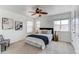 Serene bedroom with a ceiling fan, natural light, and neutral decor at 3353 Wabash St, Denver, CO 80238