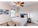 Cozy bedroom with a ceiling fan, window, and stylish decor at 3353 Wabash St, Denver, CO 80238