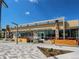 Modern commercial building featuring large windows, outdoor seating, and stylish architecture at 3353 Wabash St, Denver, CO 80238