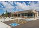 Modern commercial building featuring a 'Next Door' establishment and ample parking space at 3353 Wabash St, Denver, CO 80238