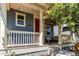 Inviting front porch with a cozy seating area and decorative string lights at 3353 Wabash St, Denver, CO 80238