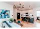 Modern kitchen with a large island, stainless steel appliances and dining area at 3353 Wabash St, Denver, CO 80238