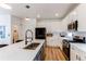 Stylish kitchen with a large center island, white cabinets, stainless steel appliances, and sleek black hardware at 3353 Wabash St, Denver, CO 80238