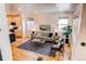 Spacious living room with large windows, modern decor, and an open layout at 3353 Wabash St, Denver, CO 80238