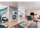 Open-concept space showing the living room, dining area, and kitchen, perfect for entertaining at 3353 Wabash St, Denver, CO 80238