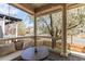 Inviting front porch with cushioned seating and views of the neighborhood at 3353 Wabash St, Denver, CO 80238