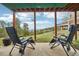 Inviting back patio with comfortable seating, offering stunning views of the lush landscape at 758 Chimney Creek Dr # C, Golden, CO 80401