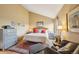 Warm bedroom featuring decorative lamps, carpet flooring and side tables at 758 Chimney Creek Dr # C, Golden, CO 80401