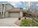 Charming home featuring a two-car garage, neutral exterior, and manicured landscaping at 758 Chimney Creek Dr # C, Golden, CO 80401