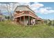 Exterior view showcasing a multi-level deck and a well-maintained yard at 758 Chimney Creek Dr # C, Golden, CO 80401