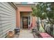 Inviting front porch with neutral pillars, stylish decor, and comfortable seating area at 758 Chimney Creek Dr # C, Golden, CO 80401