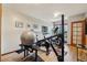 Bright home gym featuring various exercise equipment on wood floors, perfect for a healthy lifestyle at 758 Chimney Creek Dr # C, Golden, CO 80401