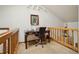 Home office with natural light and wood railing at 758 Chimney Creek Dr # C, Golden, CO 80401