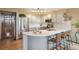 Updated kitchen with stainless appliances, stone countertops, and modern lighting at 758 Chimney Creek Dr # C, Golden, CO 80401
