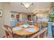 Bright eat-in kitchen with round dining table, decor lights and gray cabinets at 758 Chimney Creek Dr # C, Golden, CO 80401