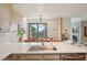 Modern eat-in kitchen with stainless sink and mountain views at 758 Chimney Creek Dr # C, Golden, CO 80401
