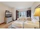 Cozy living room featuring white sofa, wood floors, and built-in bookcases at 758 Chimney Creek Dr # C, Golden, CO 80401